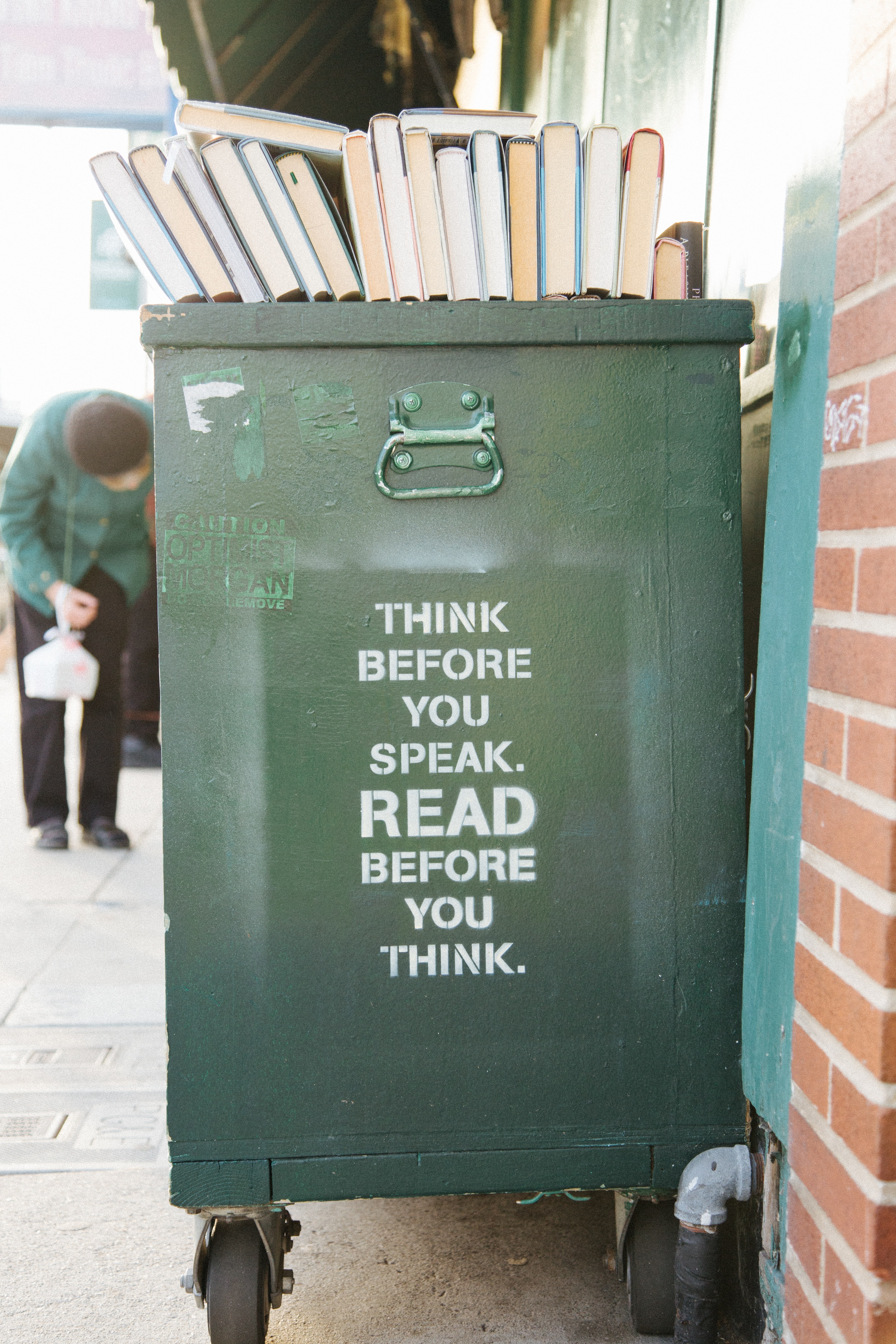 Book bin with quote on the side: \' Think before you speak. Read before you think\'